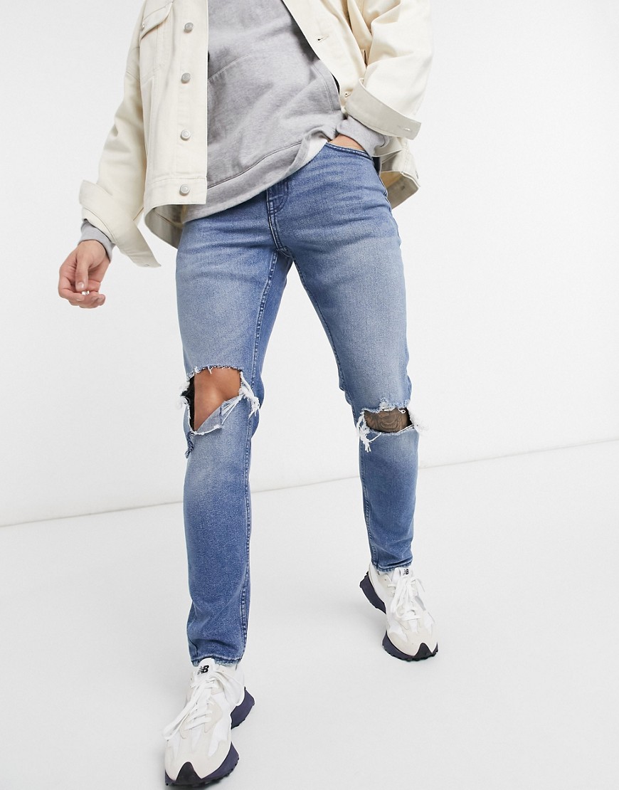 New Look - Mellemblå skinny-jeans med flænger på knæene
