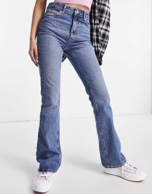 New Look mid rise flare jeans in midwash blue | ASOS