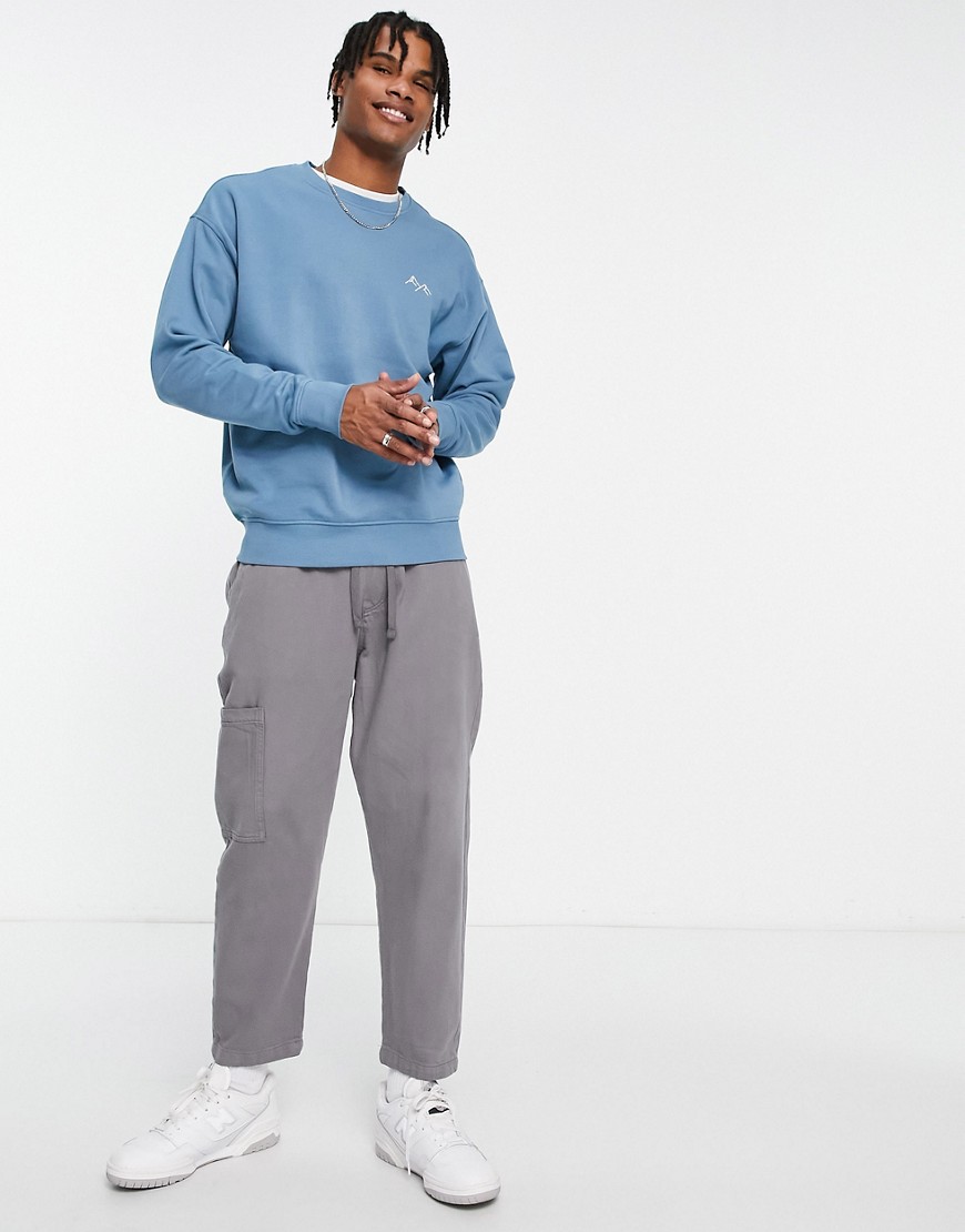 New Look mountain embroidered sweatshirt in mid blue