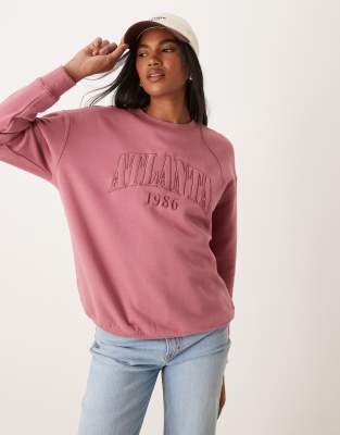 New Look - Oversize-Pullover in Rosa mit Atlanta-Schriftzug