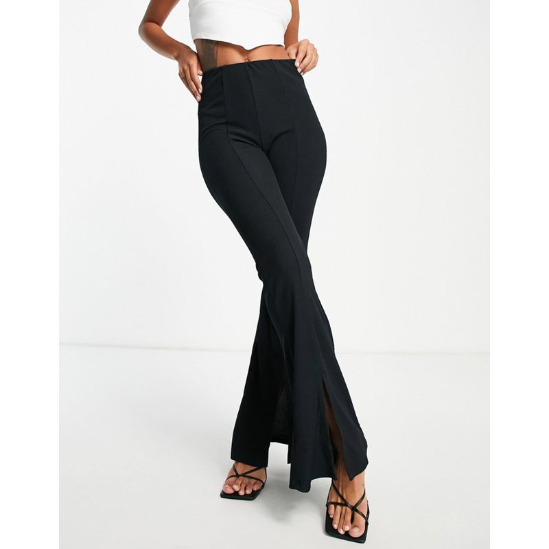 Donna Pantaloni e leggings New Look - Pantaloni a zampa neri a coste con spacco sul davanti