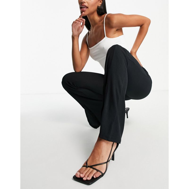 Donna Pantaloni e leggings New Look - Pantaloni a zampa neri a coste con spacco sul davanti