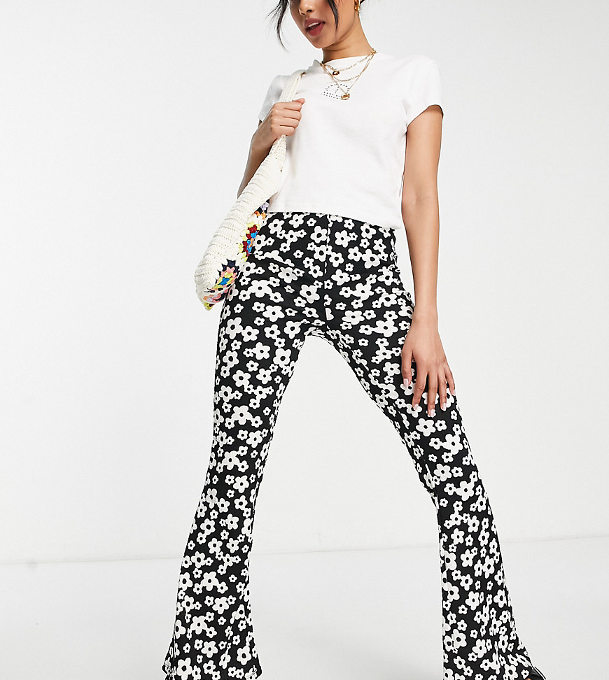 New Look Petite flare trousers in black retro floral print