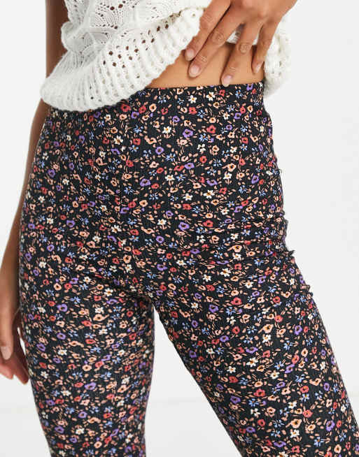 New Look Petite flared trousers in black floral print