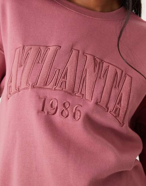 New Look Pull oversize avec slogan Atlanta Rose