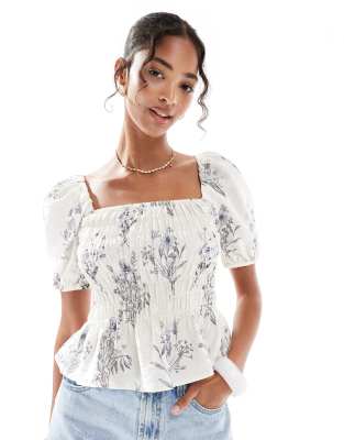 New Look New Look shirred short sleeve milkmaid top in floral print-White