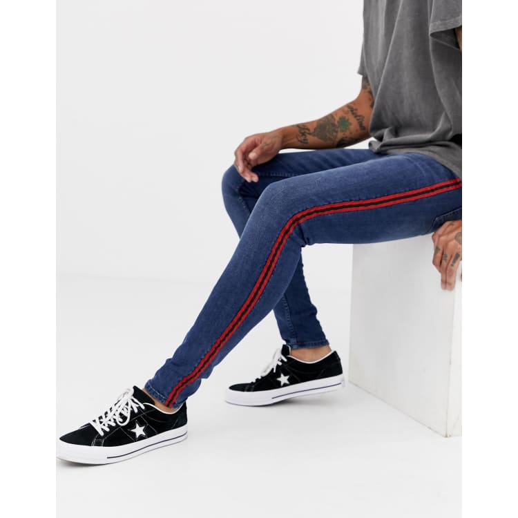 Jeans with red store and blue stripe