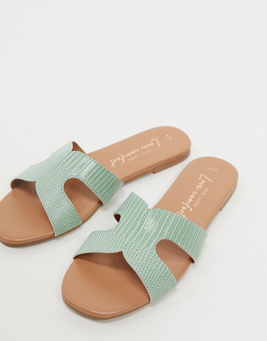 New Look - Slippers met gekruiste bandjes en hagedissenmotief in mintgroen