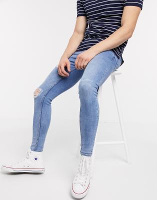tight blue ripped jeans