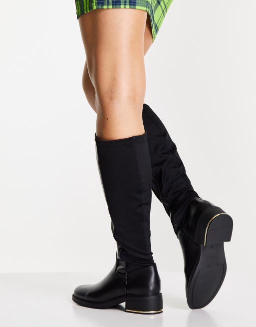 Knee high boots with clearance stretch back