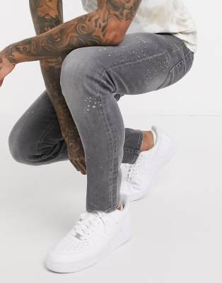 grey jeans with white paint