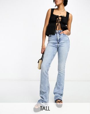 New Look Tall acid wash flared leg jean with hem detail in blue