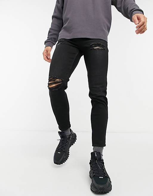 New Look tapered jeans with rips in black
