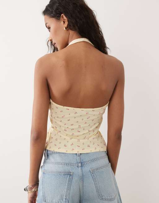 New Look - Top amarillo con estampado de florecitas, cuello halter y lazada delantera, 4 de 4