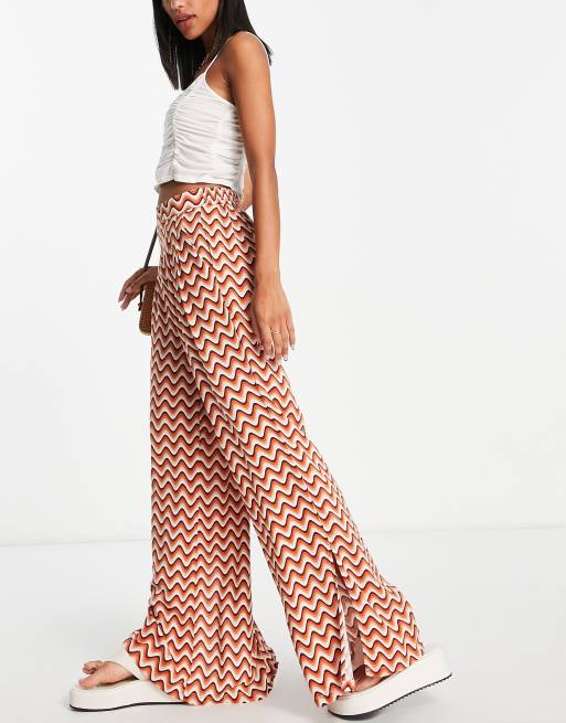 New Look wide leg trouser with split hem in orange retro wave print