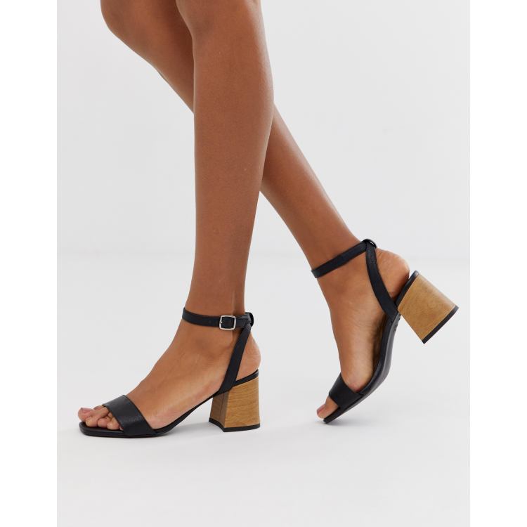 Black wooden store block heel sandals