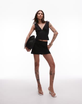 Nia eva fitted plemet mini skirt in black