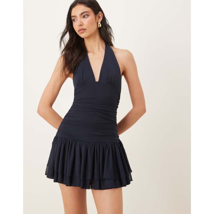 NIA Vermont halter neck ruffle edged mini dress in navy | ASOS