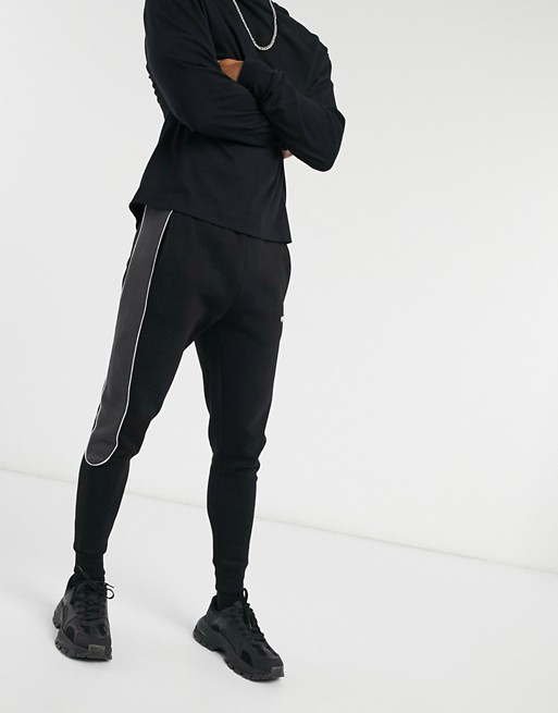 Nicce ark joggers with piping in black and coal