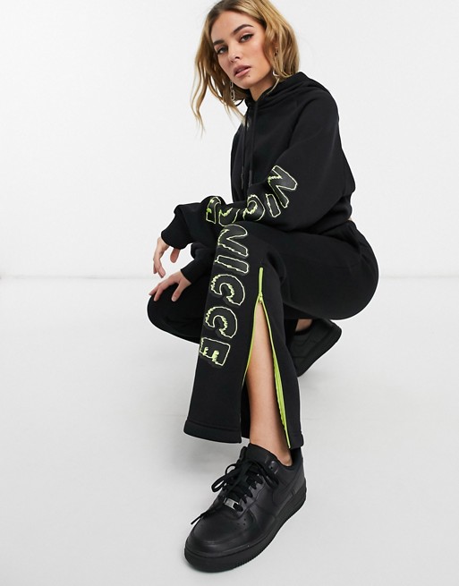 Nicce flared tracksuit bottoms with side stripe and splits co-ord