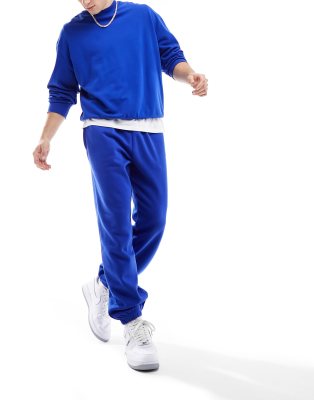 Nicce Mercury relaxed fit trackies in royal blue