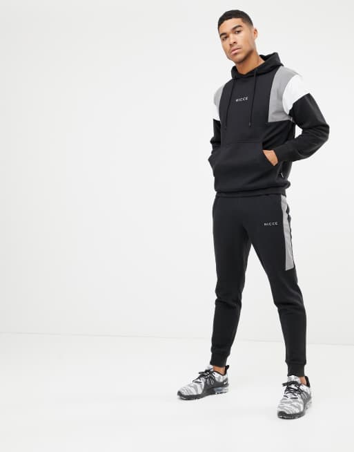 Nicce skinny joggers in black with reflective panels ASOS