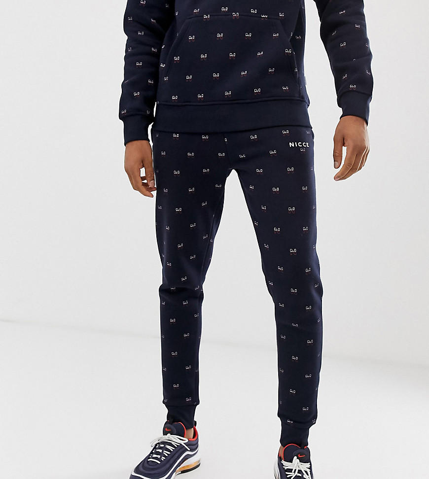Nicce skinny joggers with all over print in navy