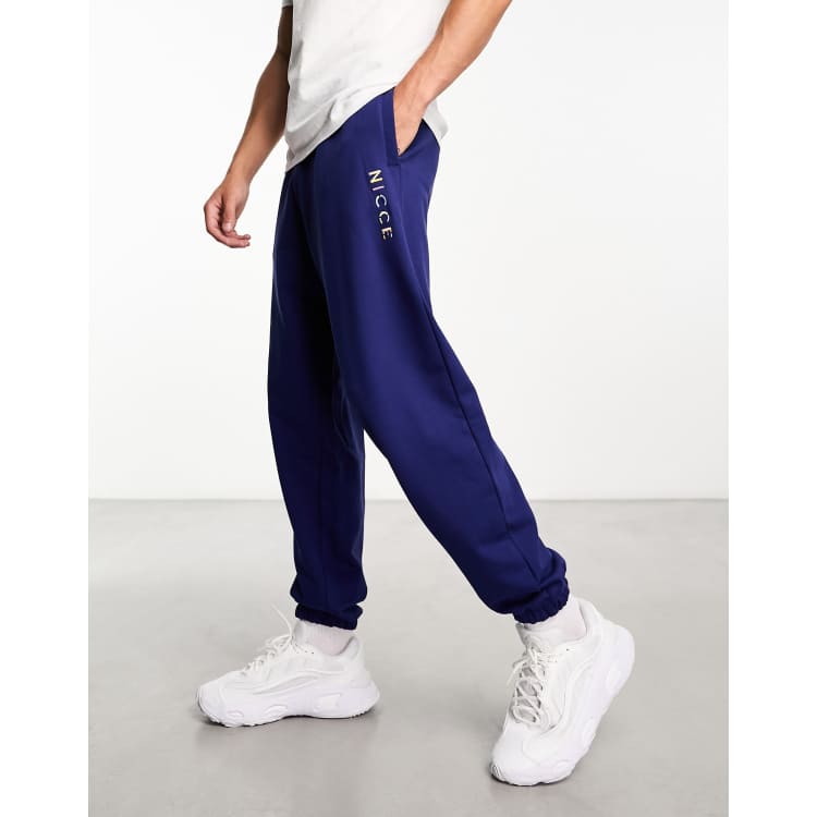 Nicce split logo jersey joggers in navy ASOS