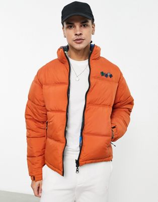 Nicce tumble reversible puffer jacket in orange