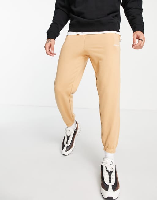 Night Addict – Jogginghose in Orange mit Print