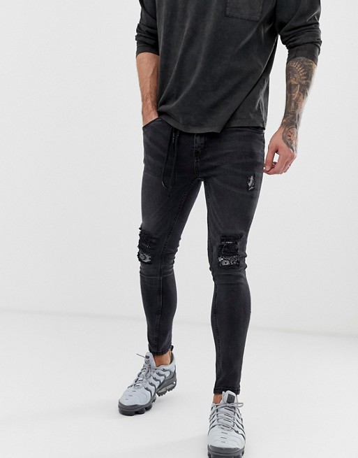 Night Addict skinny fit ripped jeans with waist rope | ASOS