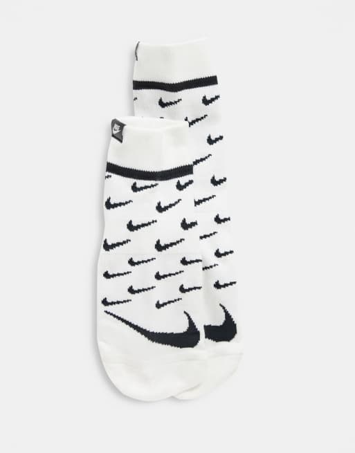 Nike socks with store swoosh on front