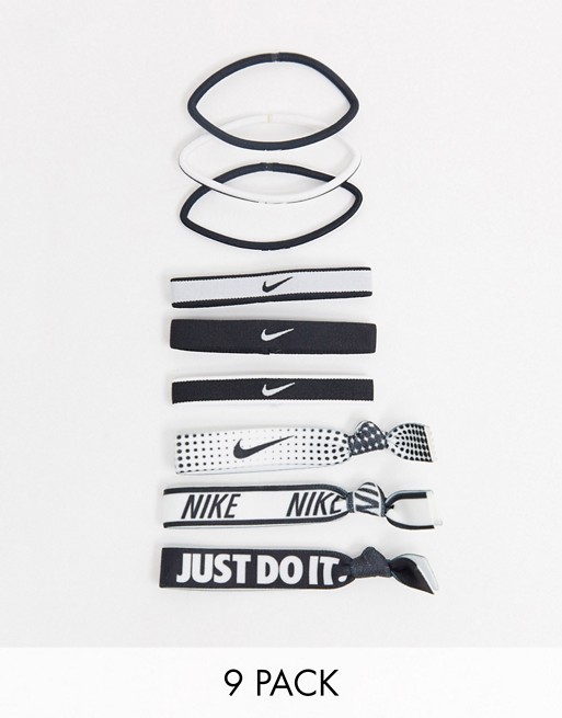 Nike 9 pack mixed hairbands in black and white with logo print