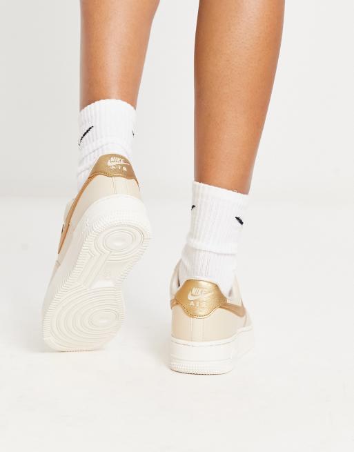 Nike air force store 1 pink gold