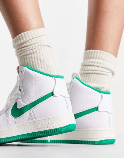 White nike with store green swoosh