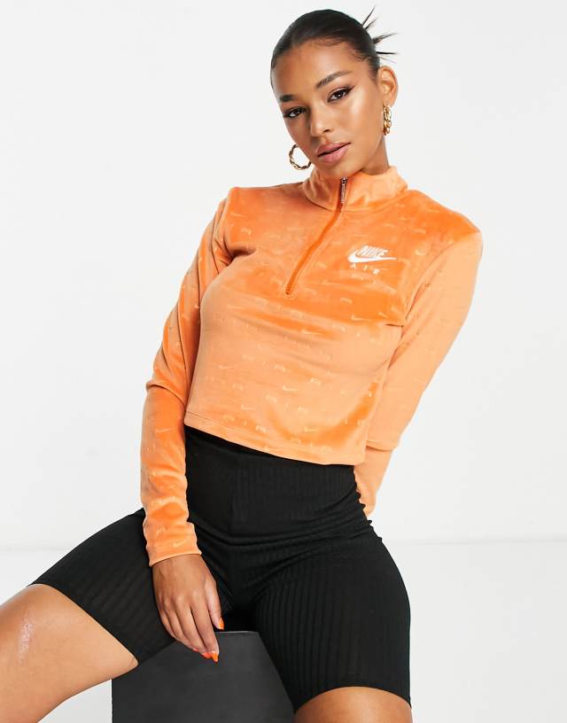 Nike Air all over logo quarter-zip velour long sleeve top in spice