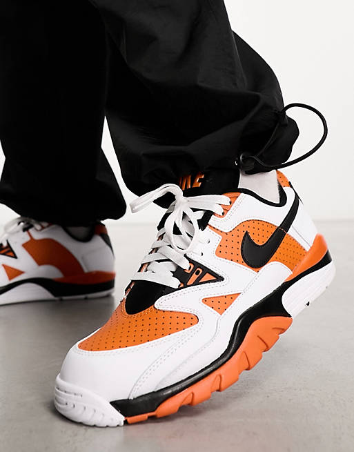 Nike Air Cross Low sneakers in white & orange | ASOS