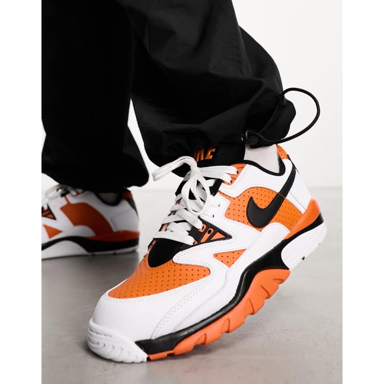 White nike trainers with orange outlet tick