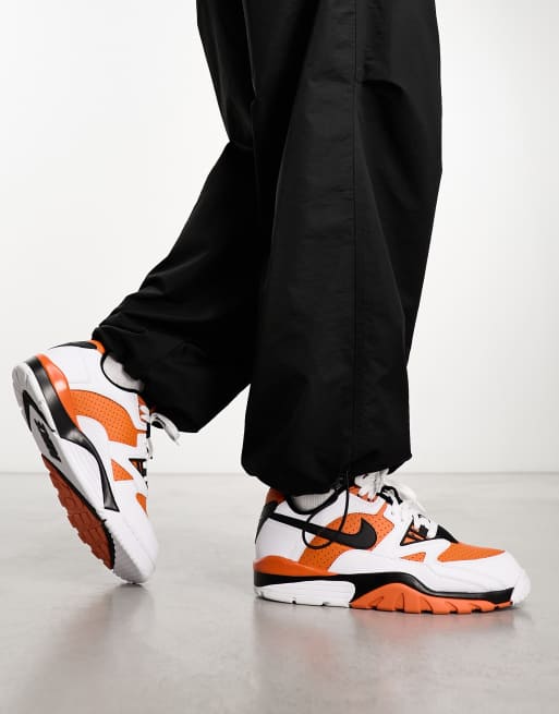 Nike Air Cross Low Sneakers in White & Orange