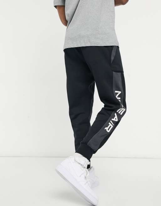 Nike air cuffed joggers best sale in black