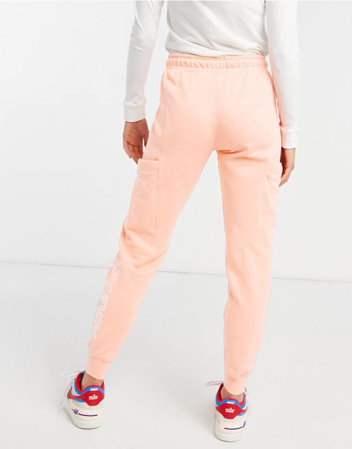 Peach nike store jogging suit