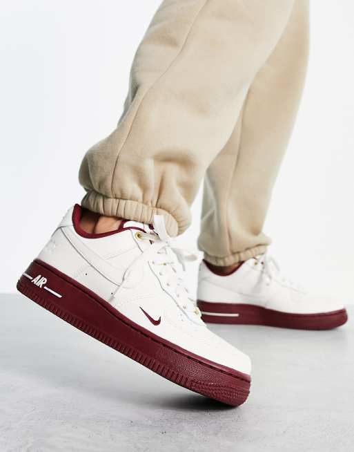 Nike Air Force 1 '07 40th anniversary sneakers in off-white and red