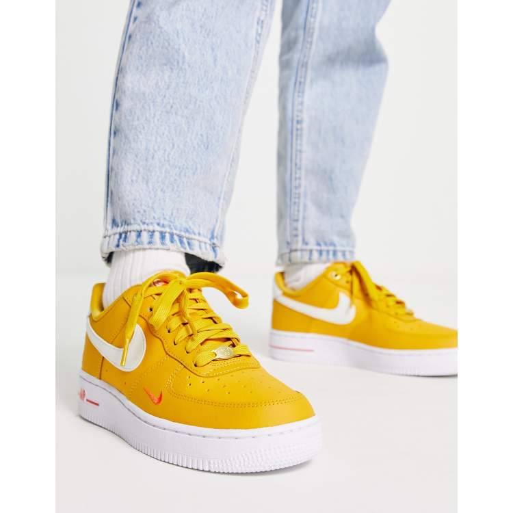 Nike Air Force 1 '07 40th anniversary sneakers in orange and white