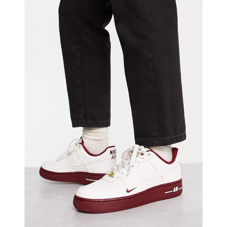 Nike Air Force 1 '07 40th anniversary sneakers in off-white and red