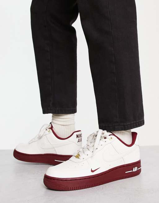 Nike Air Force 1 '07 40th anniversary sneakers in off-white and red