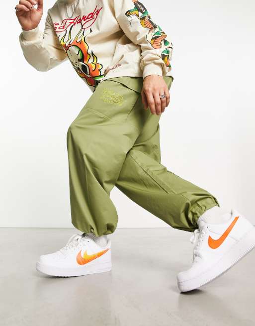 Nike Air Force 1 '07 double swoosh spray trainers in white and orange