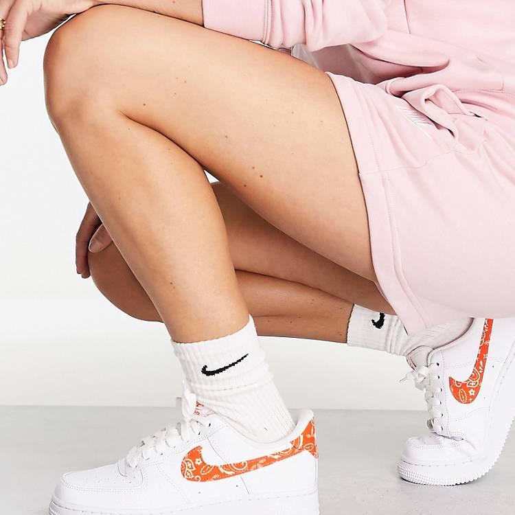 Nike Air Force 1 '07 ESS sneakers in white and orange | ASOS
