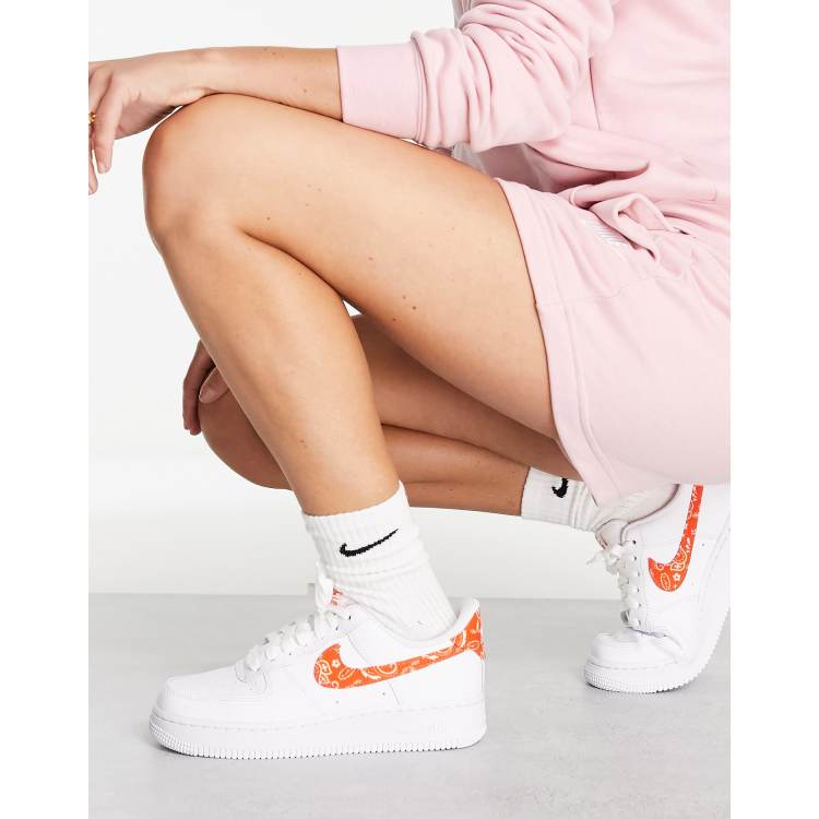 Nike Air Force 1 '07 ESS sneakers in white and orange