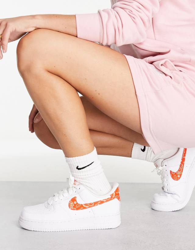 Nike Air Force 1 '07 ESS sneakers in white and orange