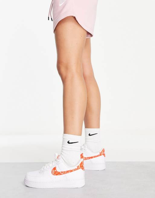 Nike Air Force 1 '07 ESS sneakers in white and orange | ASOS